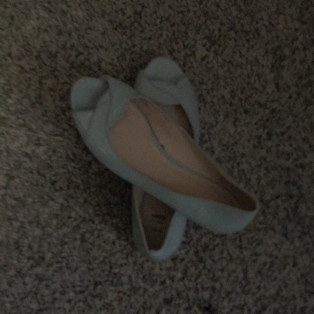 Woman’s blue green flats